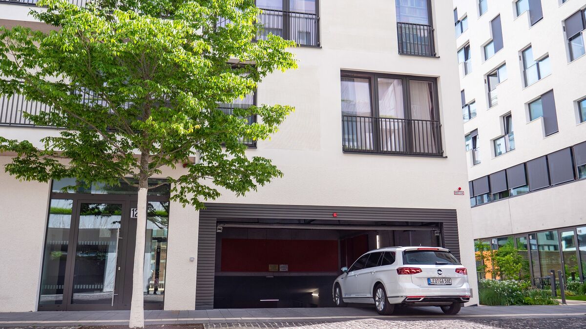 A car drives into the underground garage where the parking system is located.
