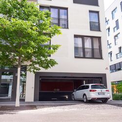 A car drives into the underground garage where the parking system is located.