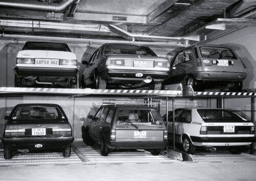 Image of a parking system with cars stacked on top of one another