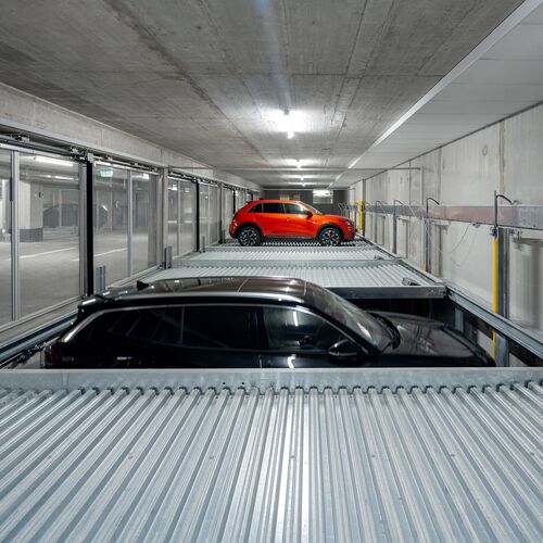 The car moves down one level in the parking system