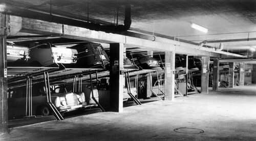 Old photo of cars parked on top of one another on multi-storey car parks
