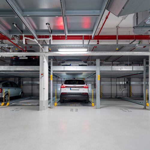 Front view of the parking system, showing a car parked in a parking space