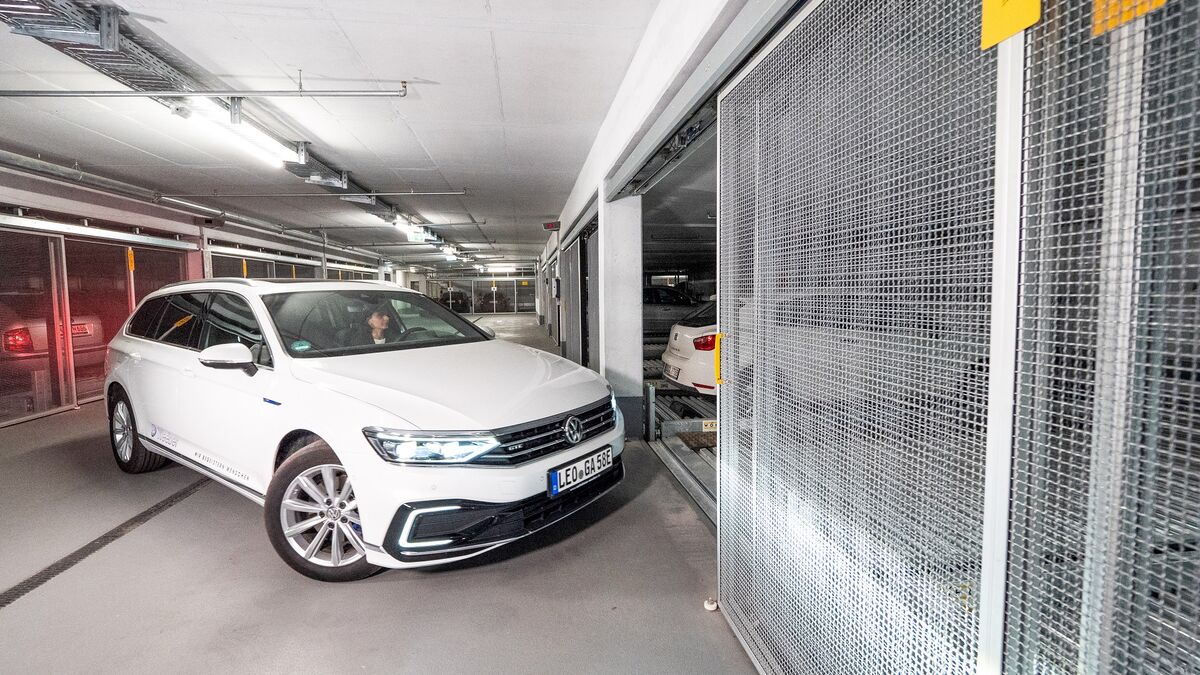 A person drives into a parking system