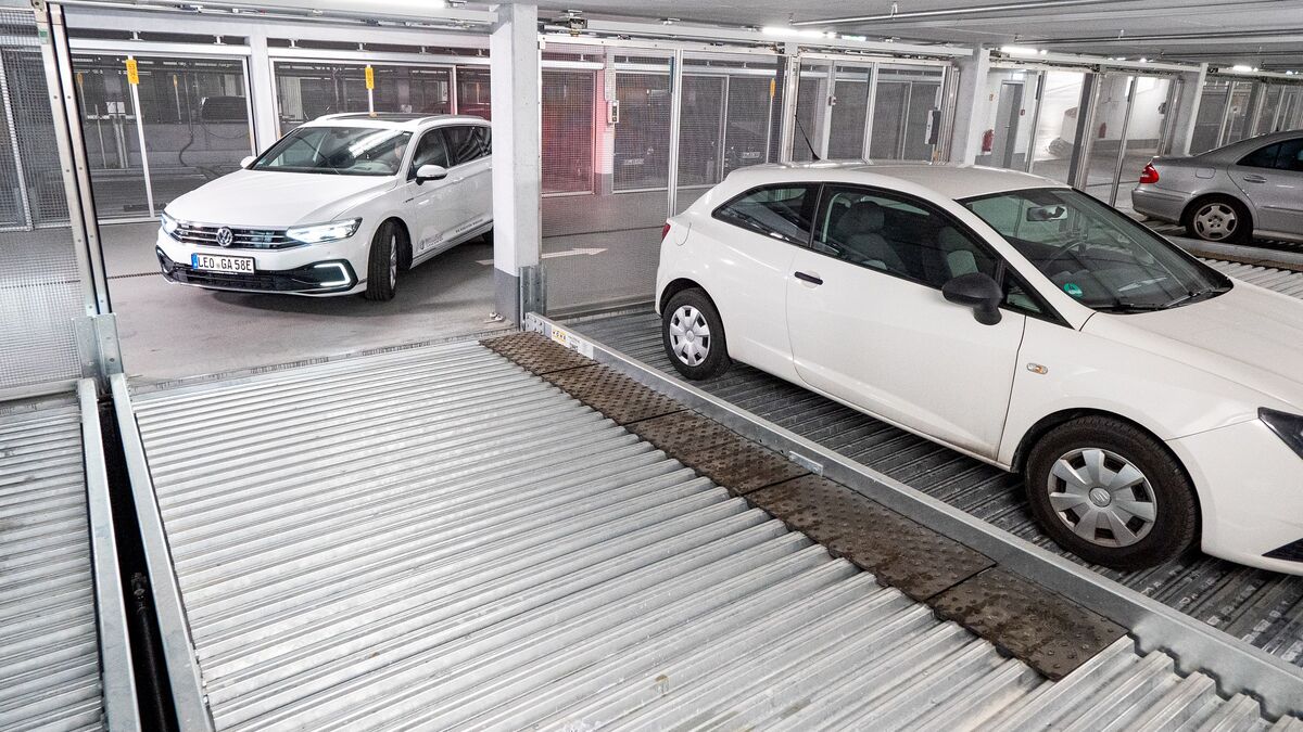A person drives into a parking system
