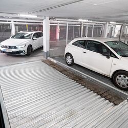 A person drives into a parking system