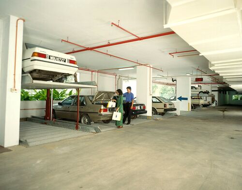 Image of a parking system with cars stacked on top of one another