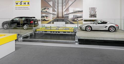 A picture of the car park with cars parked in it