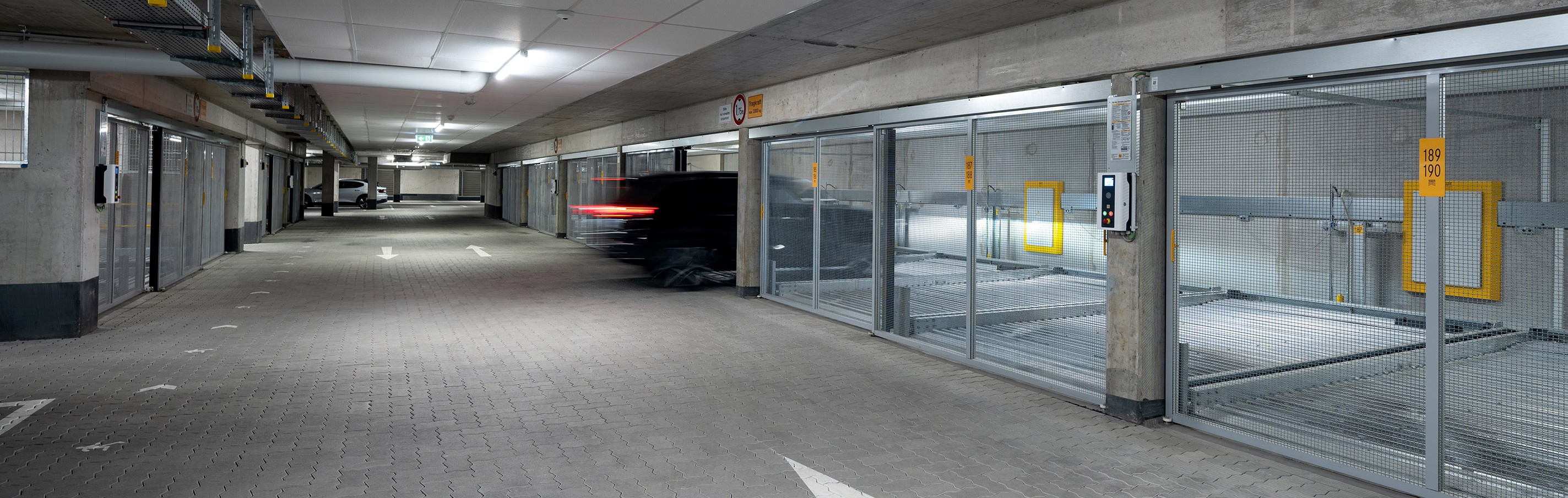 A car drives into a car parking system